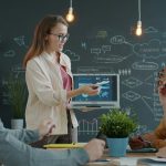 Woman presenting a business strategy to colleagues